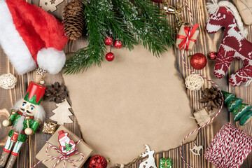 Christmas toys, fir branches, gifts, balls on a wooden background with space for text.Christmas background.