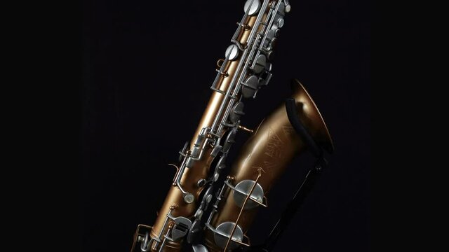 Rotating Saxophone On A Black Background.