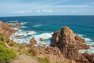 Fototapeta na wymiar View of the spectacular rocks on Cape Woolamai Surf Beach and blue waters of the Bass Strait, Phillip Island, Victoria, Australia