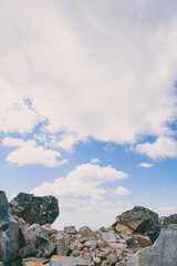 Boulders of ridge against sky. Rock climbing and mountain travel