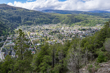Pretty little Argentinian town in Patagonia nestled in a valley at the foot of Andes seen from...