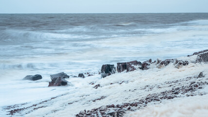 Storm on the White sea, dramatic landscape with waves rolling on the shore