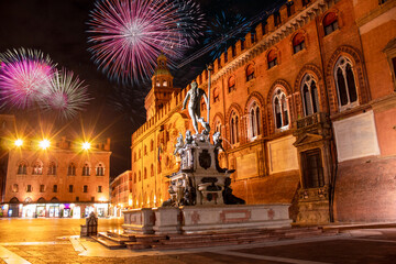 Celebratory fireworks for new year over Neptune statue in Bologna during last night of year. Christmas atmosphere © Giampaolo