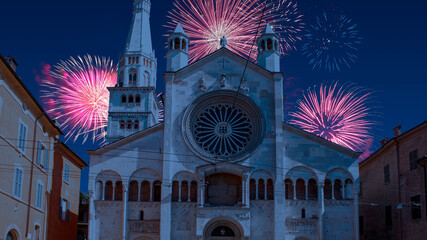 Celebratory fireworks for new year over Modena's cathedral or church in Italy during last night of year. Christmas atmosphere © Giampaolo