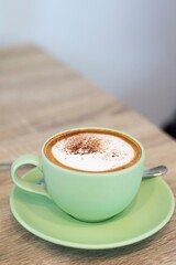 Green Cup Of Coffee Latte On Wooden Background, Close Up Of Art Coffee In Morning.