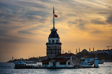 Obraz premium Istanbul, Turkey - September 2020:Maiden's Tower or Kiz Kulesi located in the middle of Bosporus in the beautiful twilight