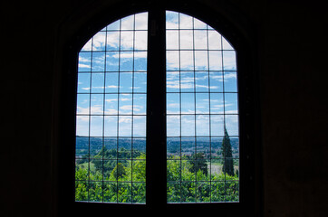 Landscape view from an old window in an ancient house.