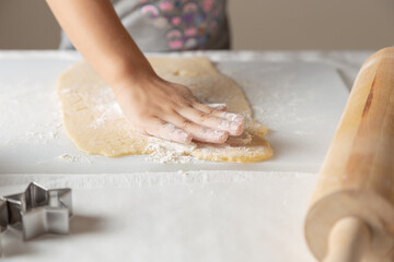 person kneading dough