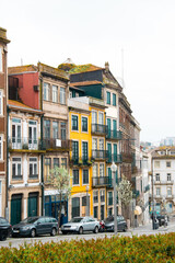 Fototapeta na wymiar Colorful old buildings and narrow streets in Porto, Portugal