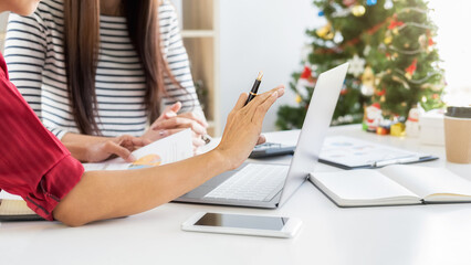 Business team are discussing financial data and report graph on last working day. Young creative...