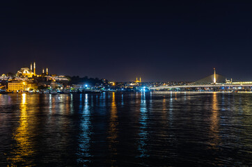 Fototapeta na wymiar Istanbul, Turkey - September 2020: night panorama with a view of Haliç Metro Bridge in Istanbul city