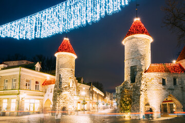 Tallinn, Estonia. Famous Landmark Viru Gate In Street Lighting At Evening Or Night Illumination....