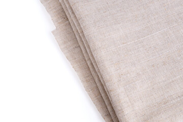 Light and dense fabric lies diagonally and is isolated on a white background. Material for cutting and sewing, as well as making clothes. The subject casts a small shadow.