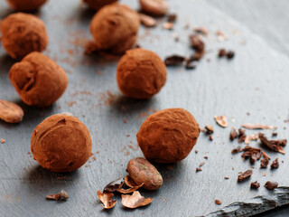 Handmade chocolate truffles and natural cocoa beans 