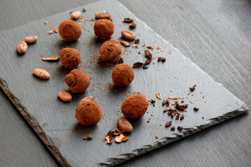 Handmade chocolate truffles and natural cocoa beans 