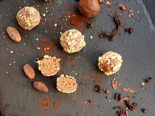 Handmade chocolates sprinkled with pistachio crumbs 