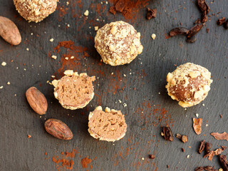 Handmade chocolates sprinkled with pistachio crumbs 