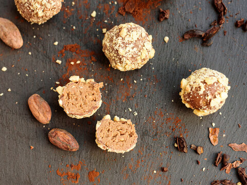 Handmade chocolates sprinkled with pistachio crumbs 