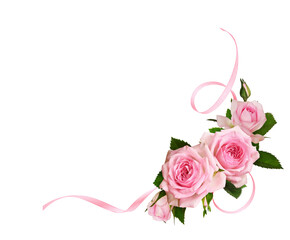 Rose flowers and twisted satin ribbon in a festive corner arrangement isolated on white