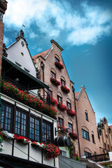 Obraz premium Old buildings and tenement houses in the city of Gdansk, historical monuments of Gdańsk, Poland.