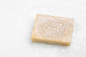 Soap with foam on a white background Soap used in everyday life, including washing, bathing