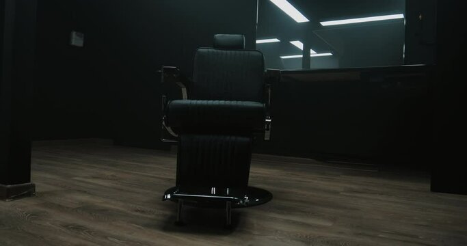 Barbershop room with two working places in the beauty salon. Hair salon interior. Empty chairs in styled barbershop. Chairs and mirrors in modern hairdressing. Interior of a modern hair salon