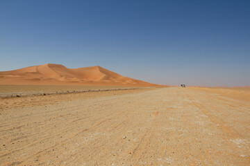 Dirt road in the desert of the Empty Quarter in Oman.