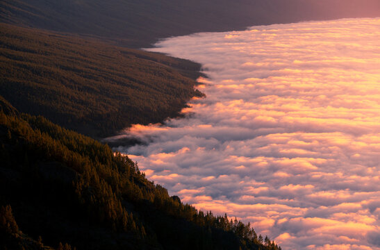 Aerial view over amazing mountainous landscape with clouds in morning in Tenerife