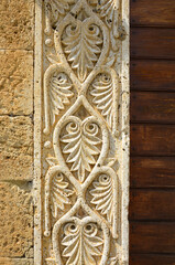 Ancient ornament, carvings on stone bricks. Original texture, background.