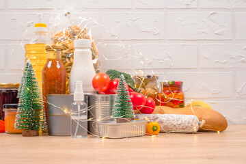 Christmas donations - food donations on light background with copyspace - pasta, fresh vegatables,...