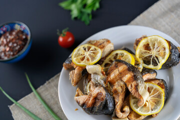 fried fish with herbs and lemon