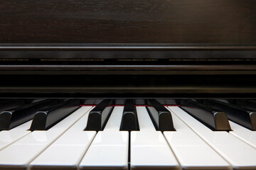 Fototapeta na wymiar Front view of black and white a jazz piano