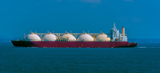 A large Liquid Natural Gas tanker ship in the Singapore Straits in Asia in summertime © Nicola