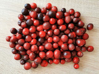 Fresh red cranberries on a wooden table