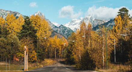 Panoramic shot of autumn mountain landscape during sunset. High Tatras, Slovakia, seen from Poprad