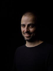 Fototapeta premium Portrait of a man in a dark environment 