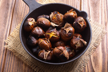Tasty fried chestnut snack background