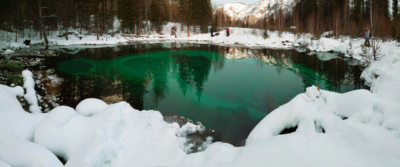 Turquoise thermal lake in Ulagan district near the village of Aktash, panorama. Altai Republic, Russia