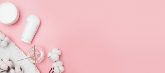 Obraz na płótnie Canvas spa concept, cotton white jars on a pink background, copy space, top view