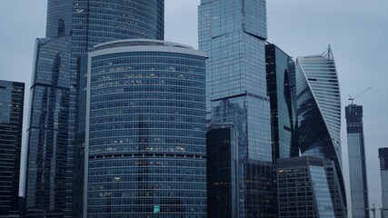 Fototapeta premium Moscow city glass skyscrapers. Famous Moscow International Business Center during an evening time, with glares from the sun