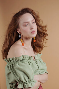 Portrait of a beautiful woman with ginger hair.