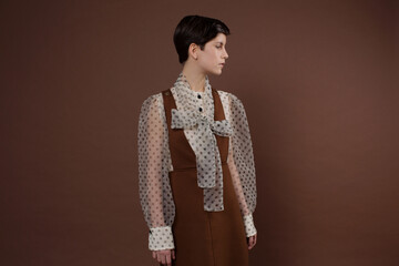 Woman with short hairstyle wearing elegant outfit