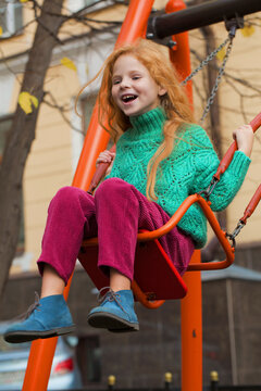 Happy kid on a swing