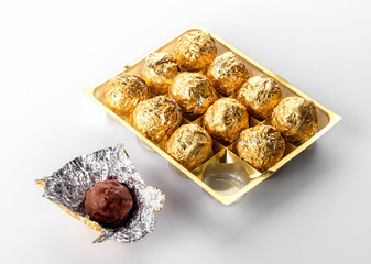 box of chocolate praines in gold foil