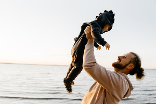 young father playing with his little son