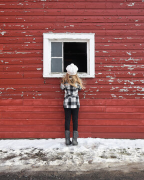 Curious Girl Looking Inside Window