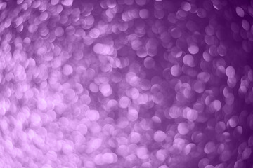 Abstract christmas bokeh blurred purple lights background.