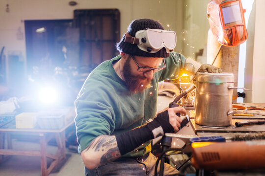 Men build a motorcycle