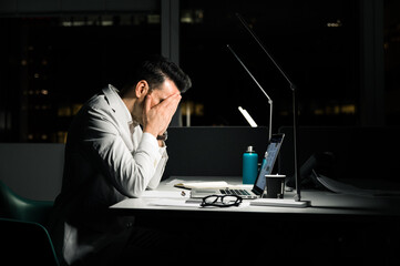 Overworked executive male employee in office