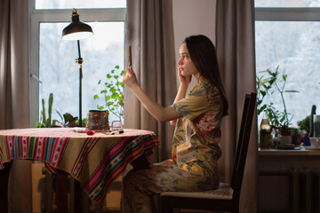 Pretty girl does make up at home